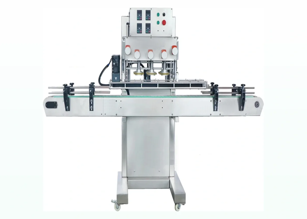 Capping machine with cap feed chute and conveyor