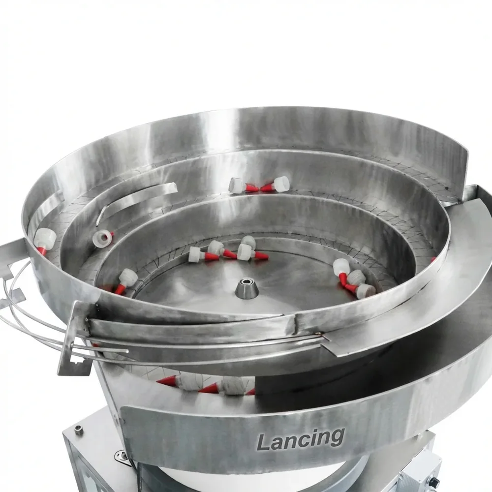 Inside a stainless bowl feeder with caps on the track